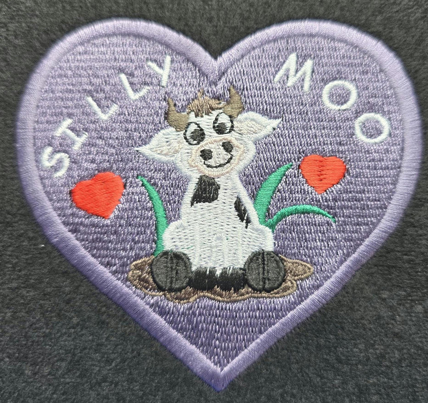 Silly Moo Embroidered Patch – Heart-Shaped Cow in Muddy Puddle