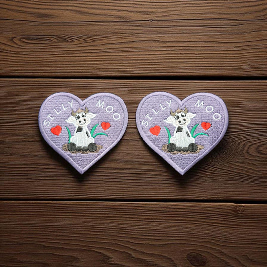 Silly Moo Embroidered Patch – Heart-Shaped Cow in Muddy Puddle