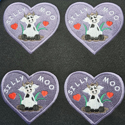Silly Moo Embroidered Patch – Heart-Shaped Cow in Muddy Puddle